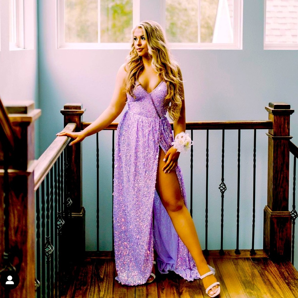 Sherri Hill size 6. Worn once. Runs big for Sherri Hill. Has a body suit liner.